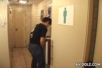 Horny Asian chick is blowing her lover's dick in a public restroom