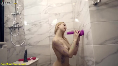 Horny teen is fucking herself with different sex toys in the shower