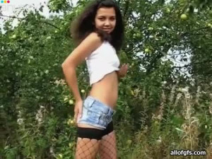 Wanton teen in sexy fishnet stockings is having a wild sex outdoors