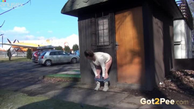 Chubby shameless brunette squats down and pisses outdoors right away