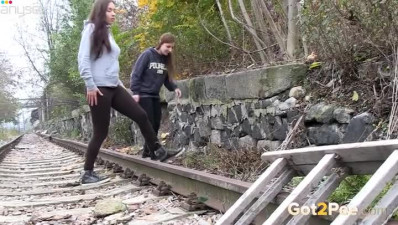 Two amateur brunette chicks wanna pee right on the train line