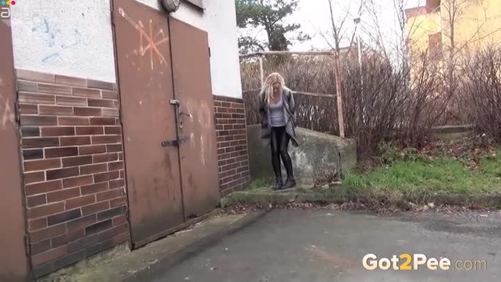 Wanton blond haired cutie adores pissing near garage Free Porn Videos | ePornAny.