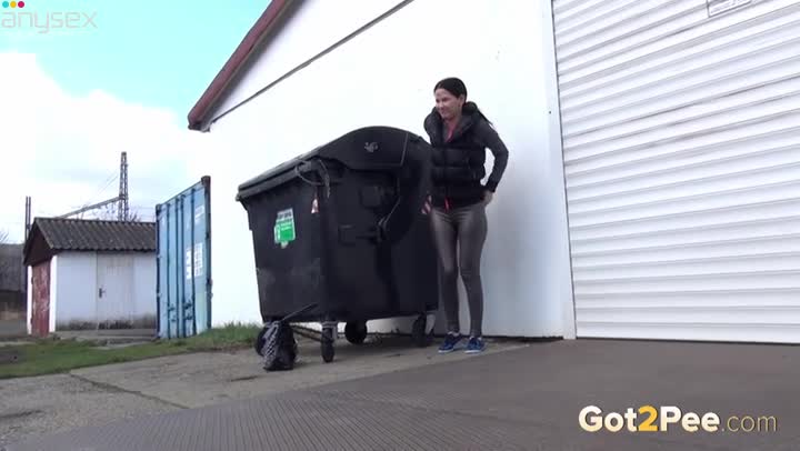 Nasty dark haired slut pisses near trash box outdoors Free Porn Videos | ePornAny.