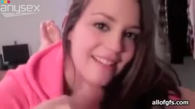 Cute brunette girlie in pink jacket happily sucks fat cock on camera