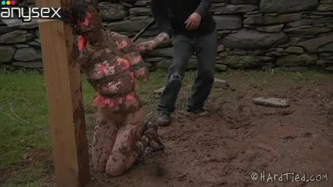 Messy brunette is tied up and covered with mud Free Porn Videos | ePornAny.