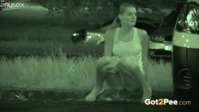 Leggy dark haired bitch pissed on the roadside in the darkness