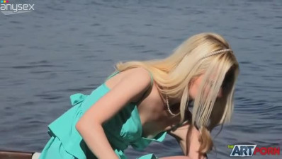 Super sexy blond girlie in blue dress masturbates on the boat