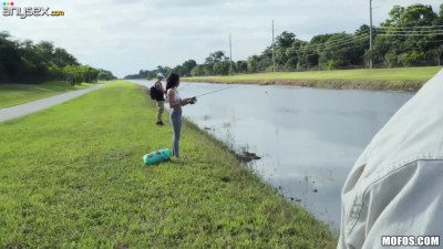 Sexy girl is catching a fish and sucking stranger's cock for money