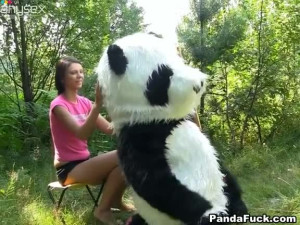 Weird sex in the woods with a huge toy panda with strap on