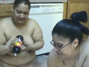 BBW lesbian girls gets messy in chocolate syrup in the kitchen