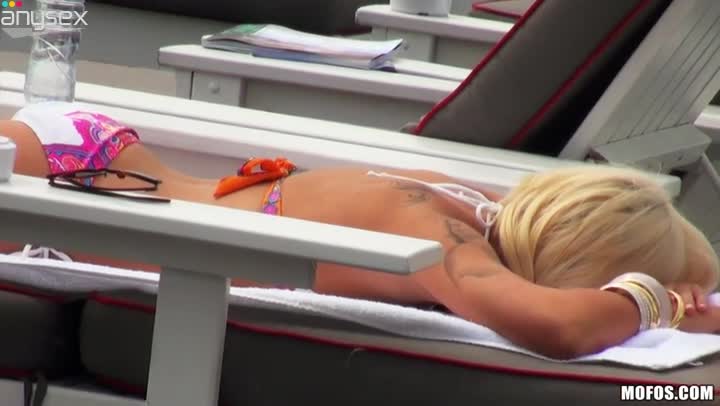 Blonde doll Charli Shiin is sun bathing on a deck chair on a yacht Free Porn Videos | ePornAny.