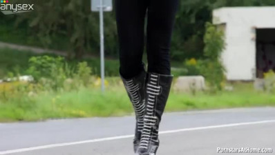 Sexy police officer wearing uniform is giving a head outdoor