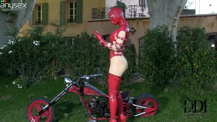 Seductive woman in red latex costume pokes her twat with dildo outdoor Free Porn Videos | ePornAny.