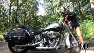 Rocking brunette bombshell masturbates on Harley