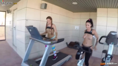 Topless chicks on a treadmill seduce one dude and enjoy hardcore threesome sex