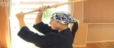 Karate girl Ai Shinozaki is stripping in a training hall