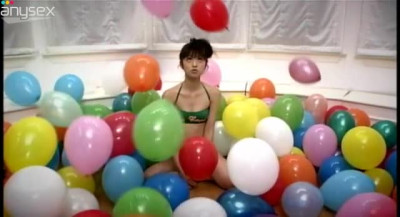 Funny Asian girlie Yuko Ogura shows her body and plays with balloons