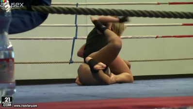 Jessica Moore wrestles with her girlfriend on the ring