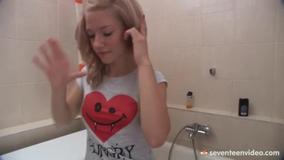 Teen Mimi plays with toy cock in the toilet tab