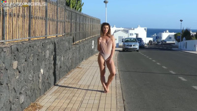 Ample breasted chick Katie Lou walks topless on the sidewalk