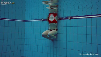 Sweet looking swimmer Katrin Bulbul is striping under the water