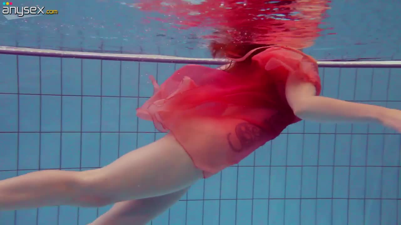 Red haired bitch Katrin Privsem takes off dress under the water Free Porn Videos | ePornAny.