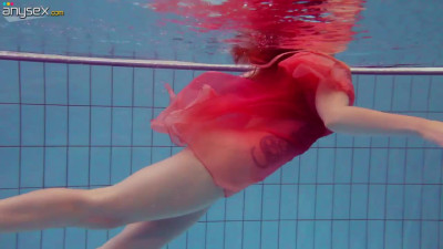 Red haired bitch Katrin Privsem takes off dress under the water